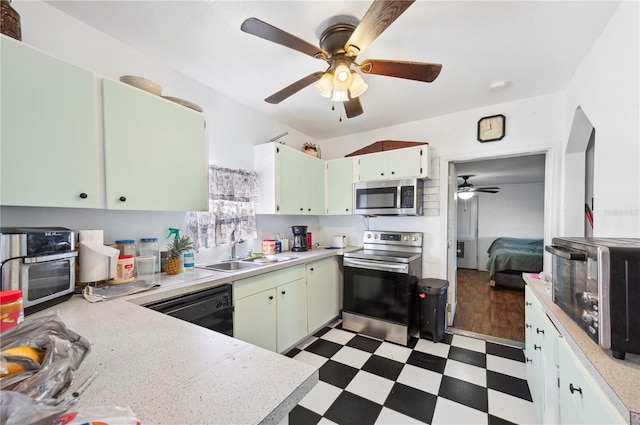 kitchen featuring white cabinetry, ceiling fan, stainless steel appliances, and sink