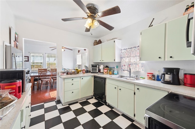 kitchen with appliances with stainless steel finishes, sink, ceiling fan, and green cabinetry