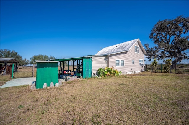 view of property exterior with a storage shed and a yard