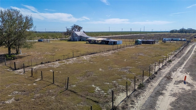 birds eye view of property with a rural view