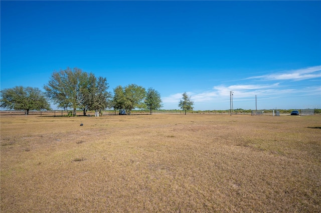 view of yard with a rural view