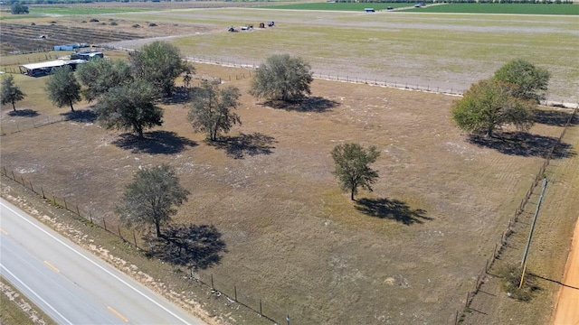 birds eye view of property with a rural view