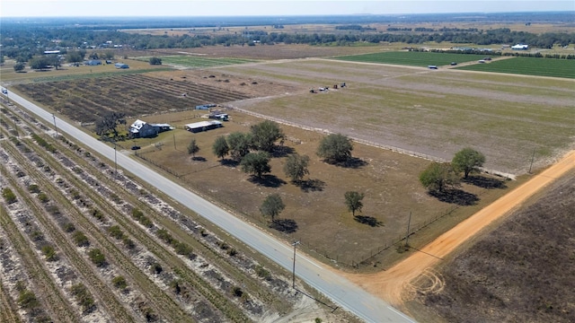 birds eye view of property with a rural view