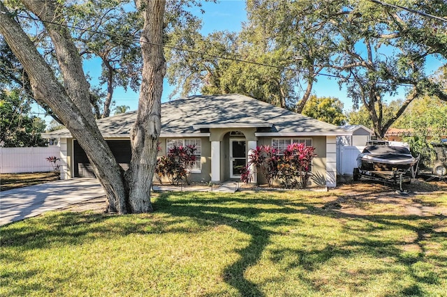 ranch-style home with a garage and a front lawn