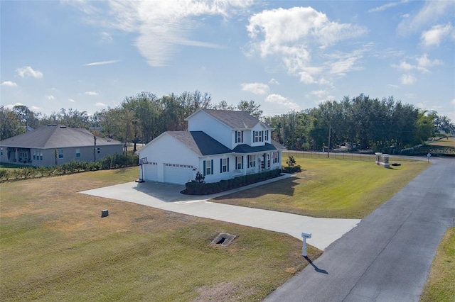 view of front of house featuring a garage and a front yard