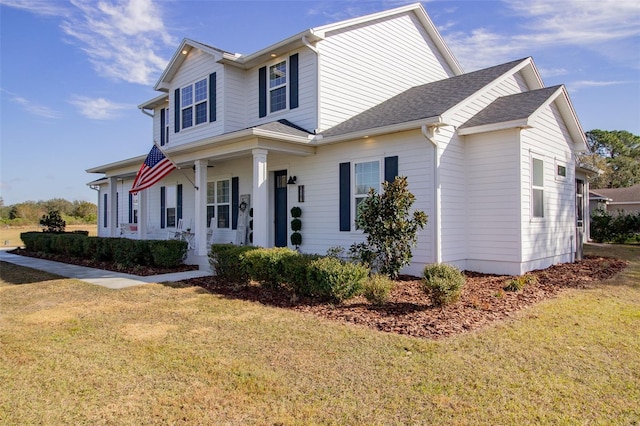 view of front of house featuring a porch and a front lawn