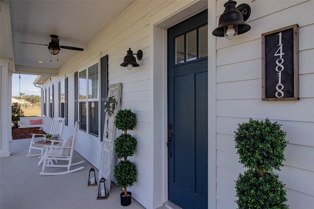 view of exterior entry with covered porch