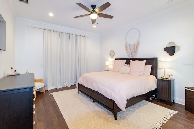 bedroom with ceiling fan, ornamental molding, and dark hardwood / wood-style floors