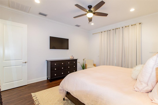 bedroom featuring ornamental molding, dark hardwood / wood-style floors, and ceiling fan