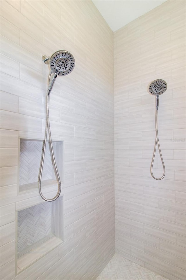 bathroom with a tile shower