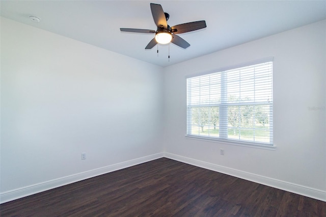 spare room featuring ceiling fan and dark hardwood / wood-style floors