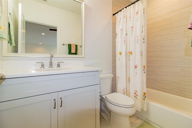 full bathroom with vanity, toilet, and shower / bath combo with shower curtain