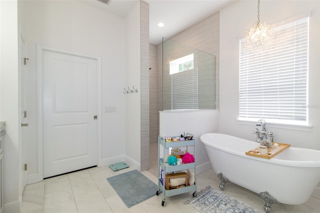 bathroom with separate shower and tub and a chandelier