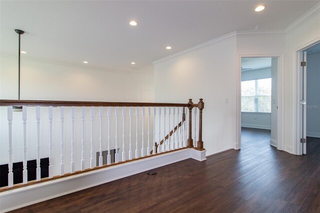 corridor featuring dark hardwood / wood-style flooring and crown molding