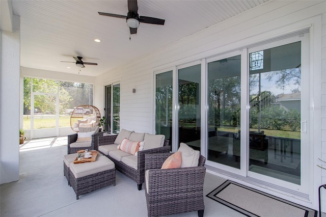 view of patio / terrace with ceiling fan and an outdoor living space