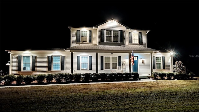 view of front of home featuring a lawn