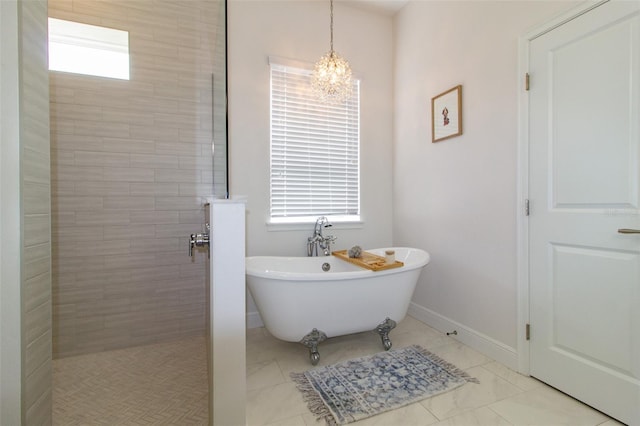 bathroom with separate shower and tub and a chandelier