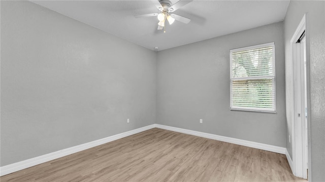 spare room with ceiling fan and light hardwood / wood-style flooring