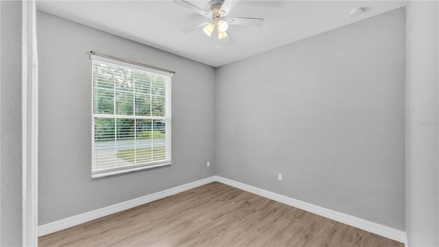 empty room featuring light wood-type flooring and ceiling fan