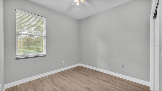 empty room featuring hardwood / wood-style flooring and ceiling fan