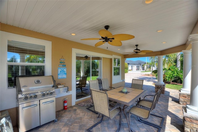 751 Meandering Way, Polk City, FL 33868 - view of patio / terrace featuring outdoor dining space, a grill, area for grilling, and ceiling fan