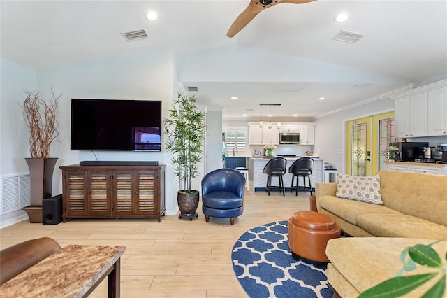 751 Meandering Way, Polk City, FL 33868 - living room with light wood-type flooring, visible vents, and ceiling fan