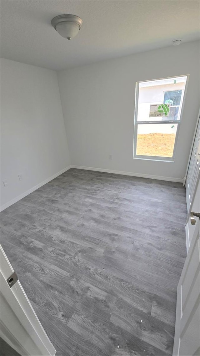 empty room with dark hardwood / wood-style floors