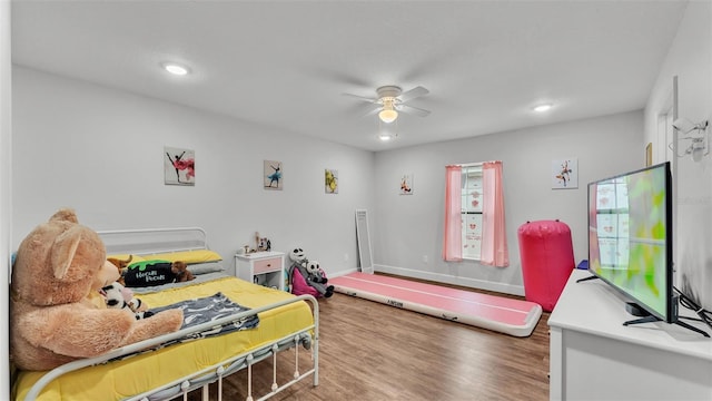 bedroom featuring recessed lighting, ceiling fan, baseboards, and wood finished floors