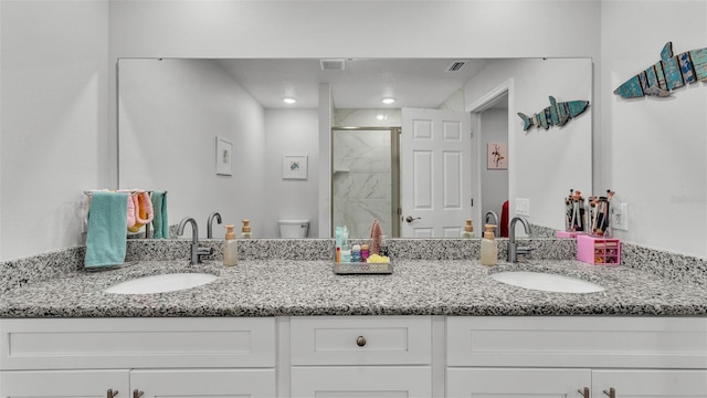 full bathroom with a shower stall, toilet, visible vents, and a sink