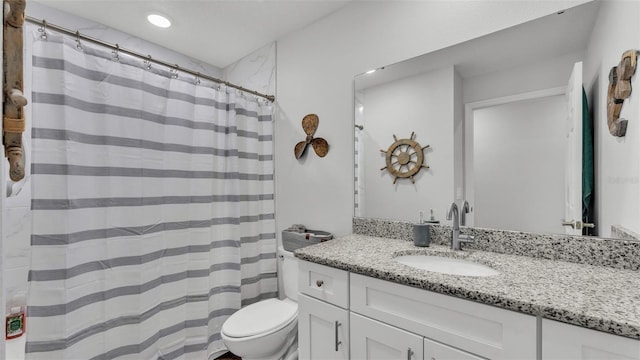 bathroom with recessed lighting, toilet, a shower with shower curtain, and vanity