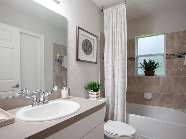 full bathroom featuring vanity, toilet, and shower / bath combo with shower curtain