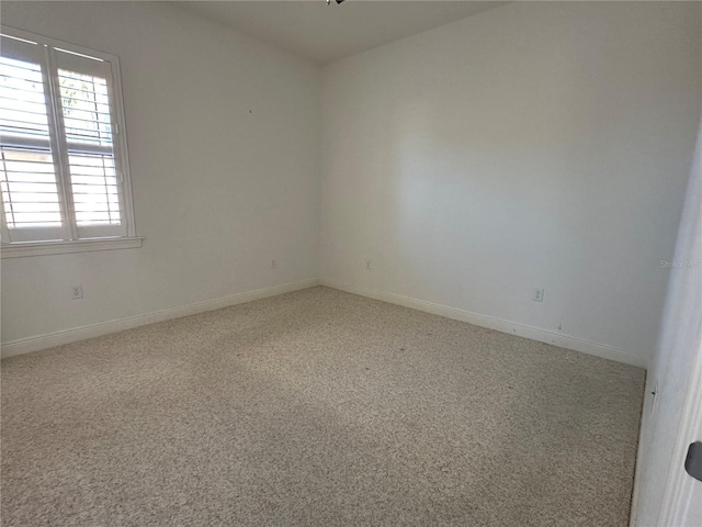 spare room with carpet