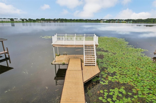 view of dock featuring a water view and stairs