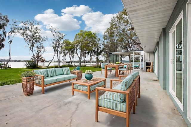 view of patio / terrace featuring outdoor lounge area and a water view