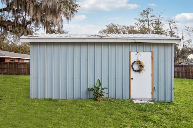 view of shed with fence