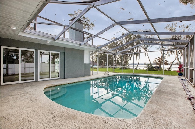 outdoor pool featuring a lanai and a patio