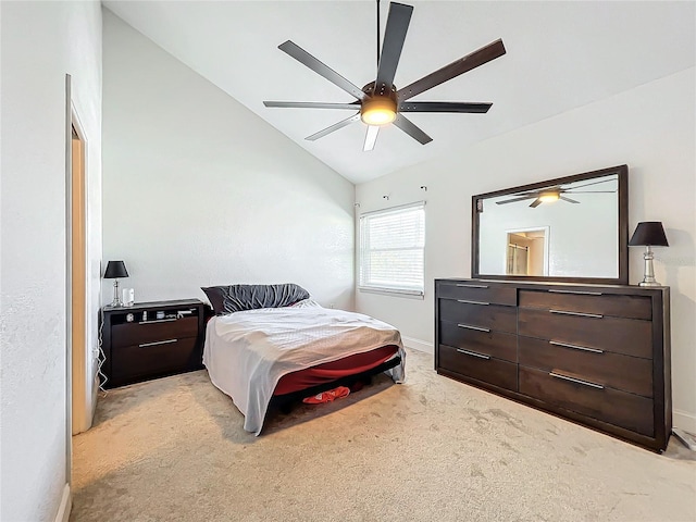 carpeted bedroom featuring ceiling fan and vaulted ceiling