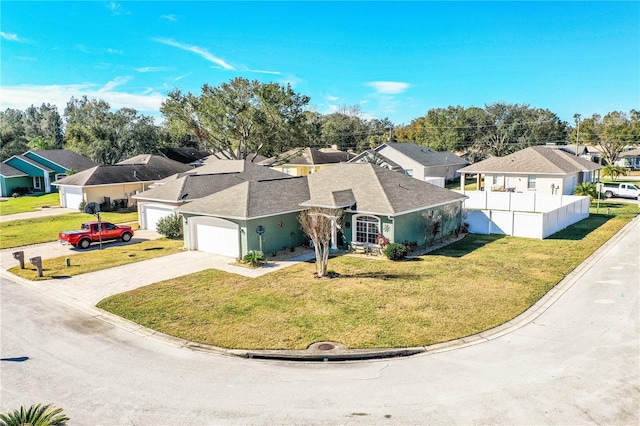 view of front of house featuring a garage and a front yard