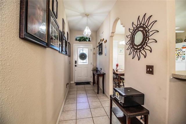 entryway featuring light tile patterned flooring