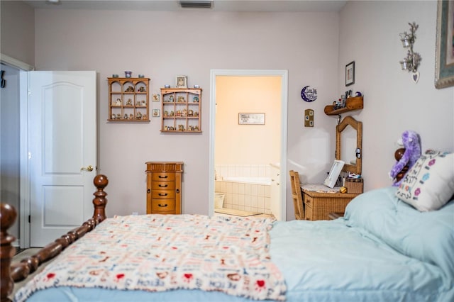 bedroom with connected bathroom