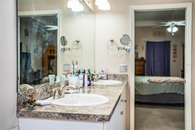 bathroom with ceiling fan and vanity