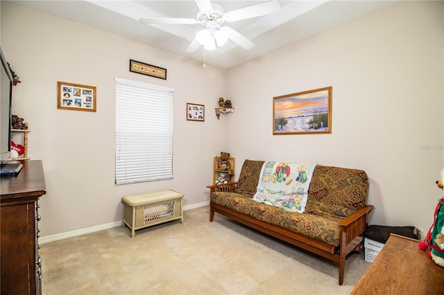 sitting room with light carpet and ceiling fan