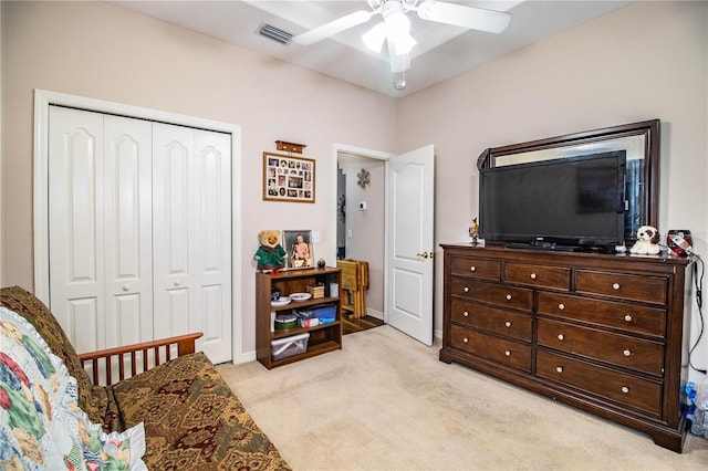 sitting room with ceiling fan and light carpet