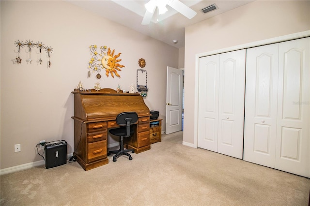 carpeted office featuring ceiling fan