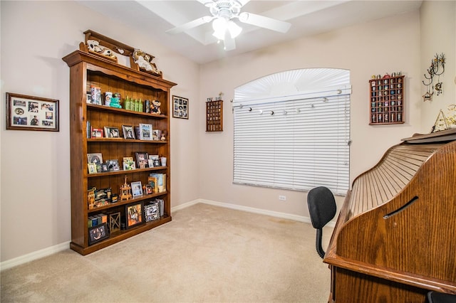 office space with ceiling fan and light carpet