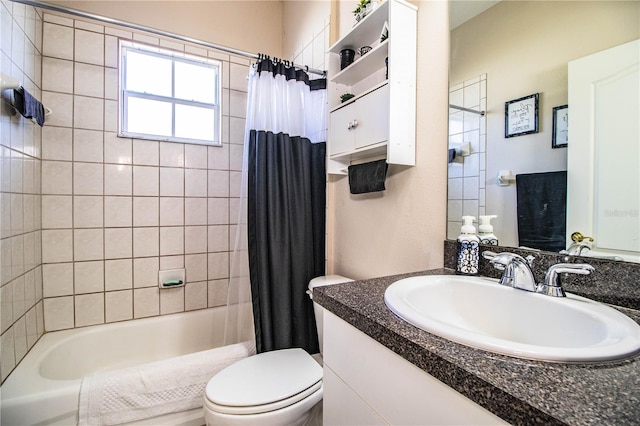 full bathroom featuring shower / tub combo with curtain, vanity, and toilet