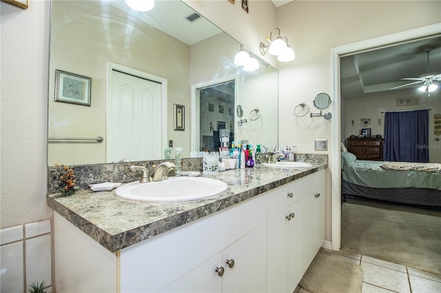 bathroom featuring vanity, tile patterned floors, and ceiling fan