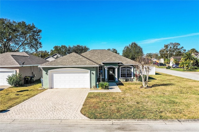 ranch-style house with a garage and a front yard