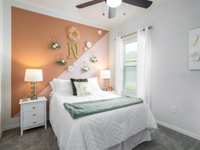 bedroom with ceiling fan and dark colored carpet