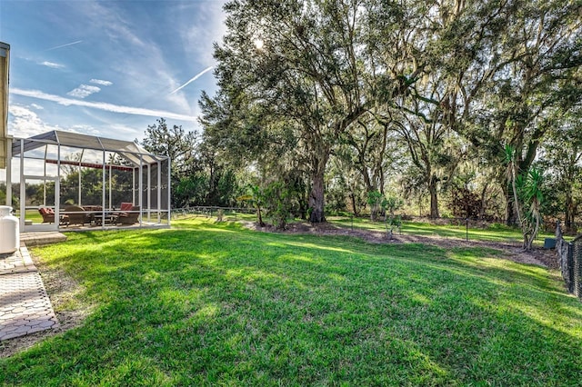 view of yard with a lanai